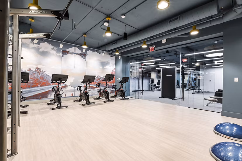Yoga and spin studio with modern equipment at SoNYa Apartments