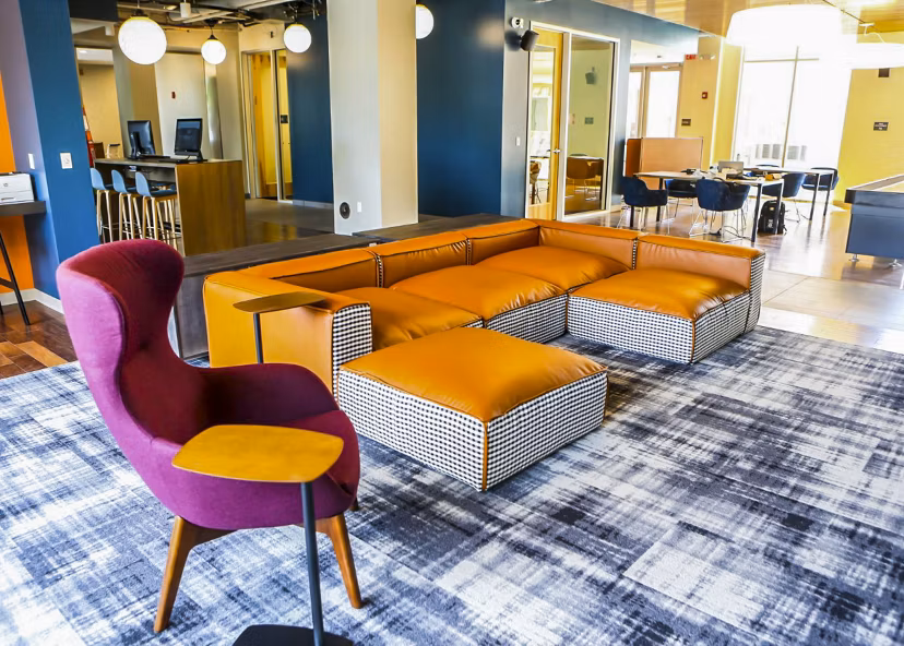 Clubhouse at The Edge Apartments: Modern communal space featuring spacious seating and game area in luxury community