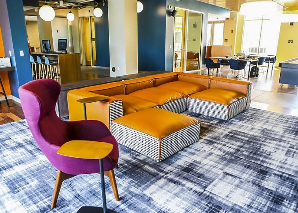 Clubhouse at The Edge Apartments: Modern communal space featuring spacious seating and game area in luxury community