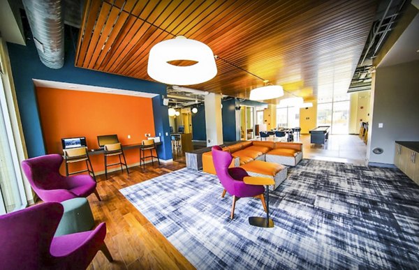 Clubhouse featuring modern design and lounge seating at The Edge Apartments