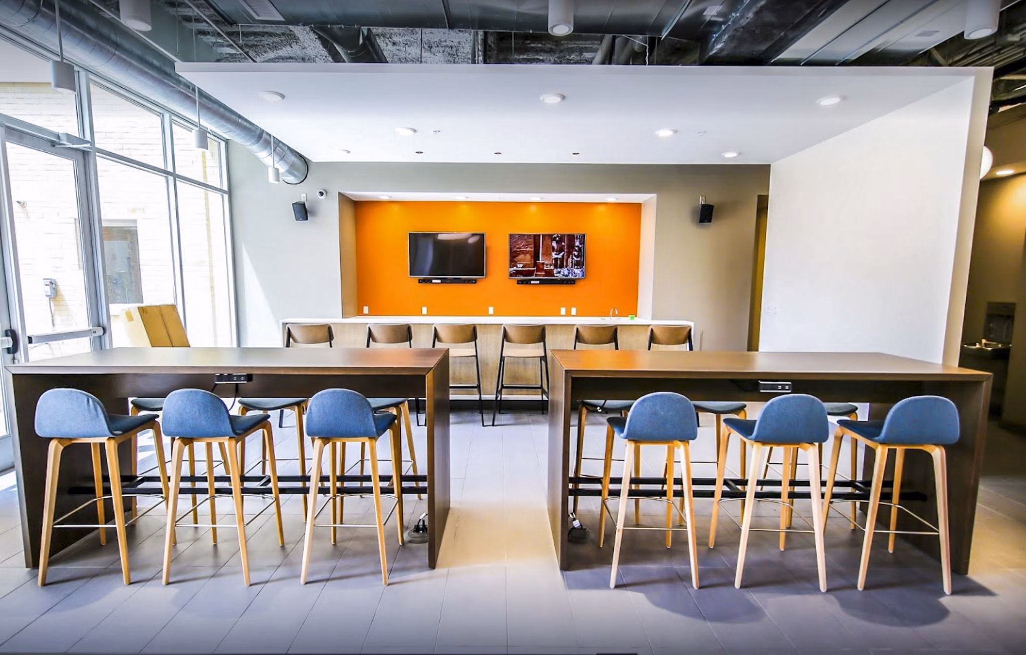 Modern clubhouse with stylish seating and entertainment areas at The Edge Apartments