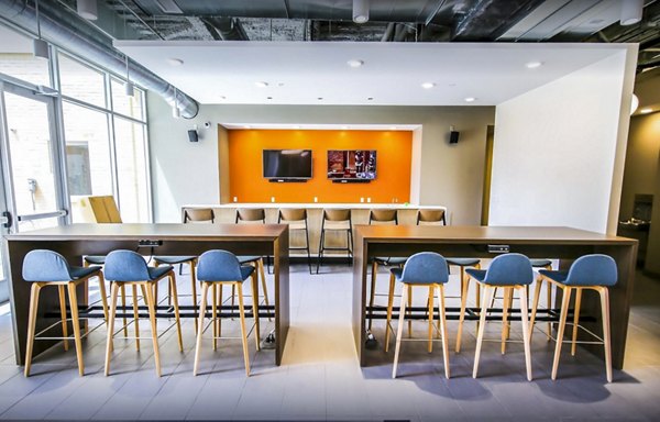 Modern clubhouse with stylish seating and entertainment areas at The Edge Apartments