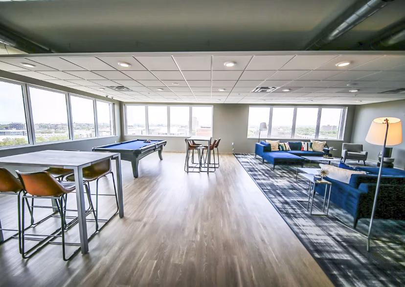Clubhouse with modern design and entertainment area at The Edge Apartments, luxury living offered by Greystar