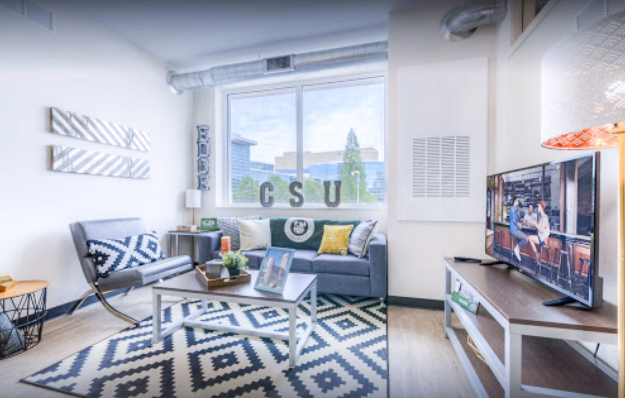 Spacious living room with modern decor at The Edge Apartments