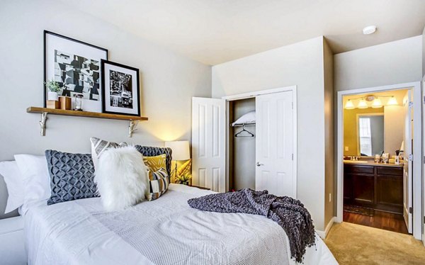 Cozy bedroom with stylish decor at The Langston Apartments