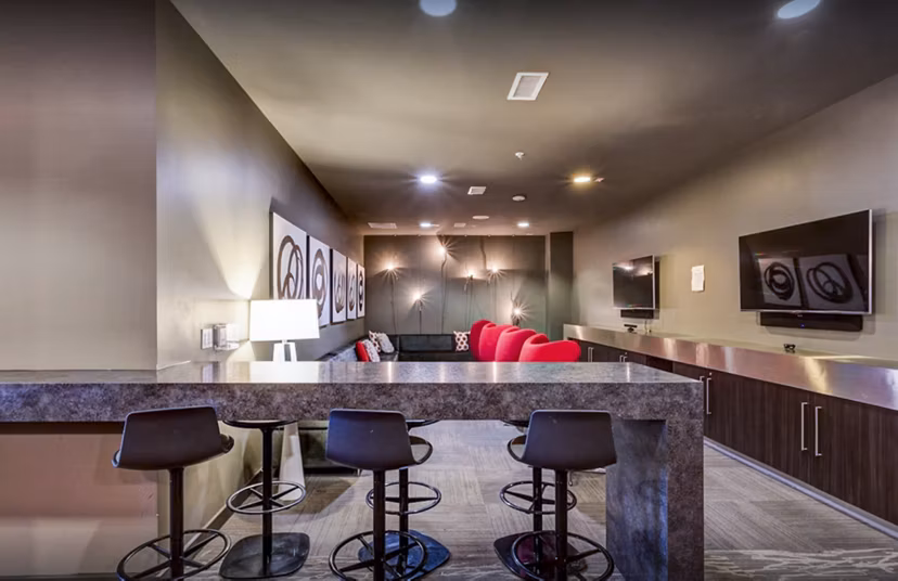 Clubhouse study area with modern furnishings at The Langston Apartments, a luxury Greystar property