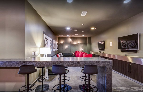 Clubhouse study area with modern furnishings at The Langston Apartments, a luxury Greystar property