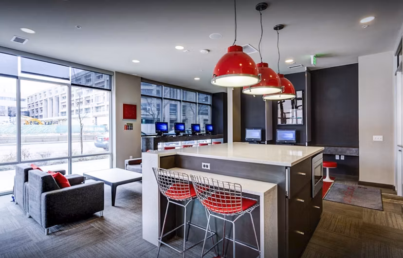 Inviting clubhouse study area with modern furnishings at The Langston Apartments, a Greystar luxury apartment community