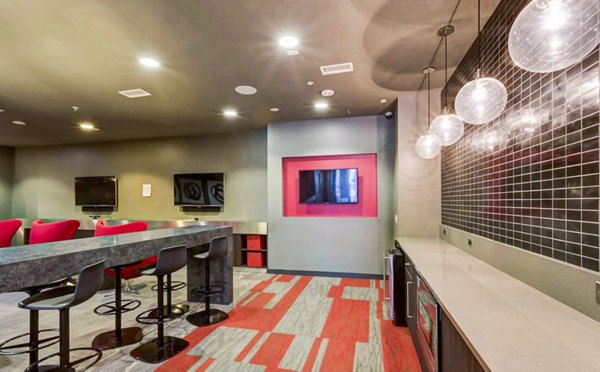 Clubhouse study area with modern furnishings at The Langston Apartments, perfect for luxury living