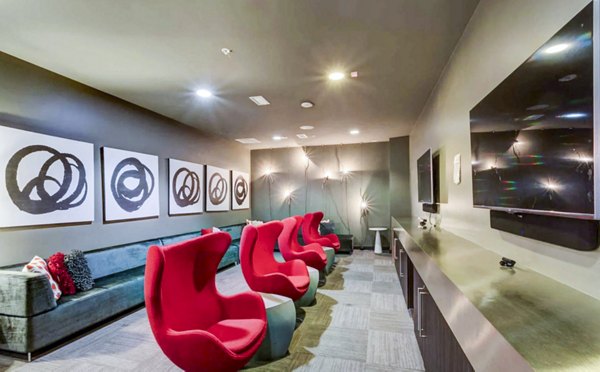 Clubhouse study area with modern furnishings at The Langston Apartments, a luxury Greystar property in an urban setting