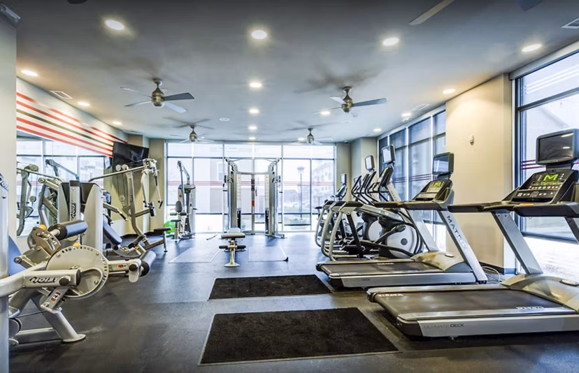 State-of-the-art fitness center with modern equipment at The Langston Apartments