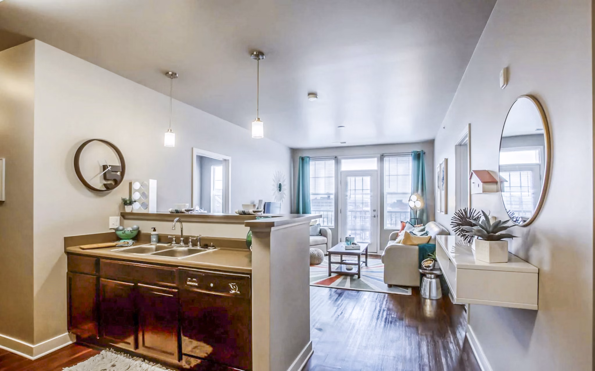 Modern kitchen with stainless steel appliances and quartz countertops at The Langston Apartments