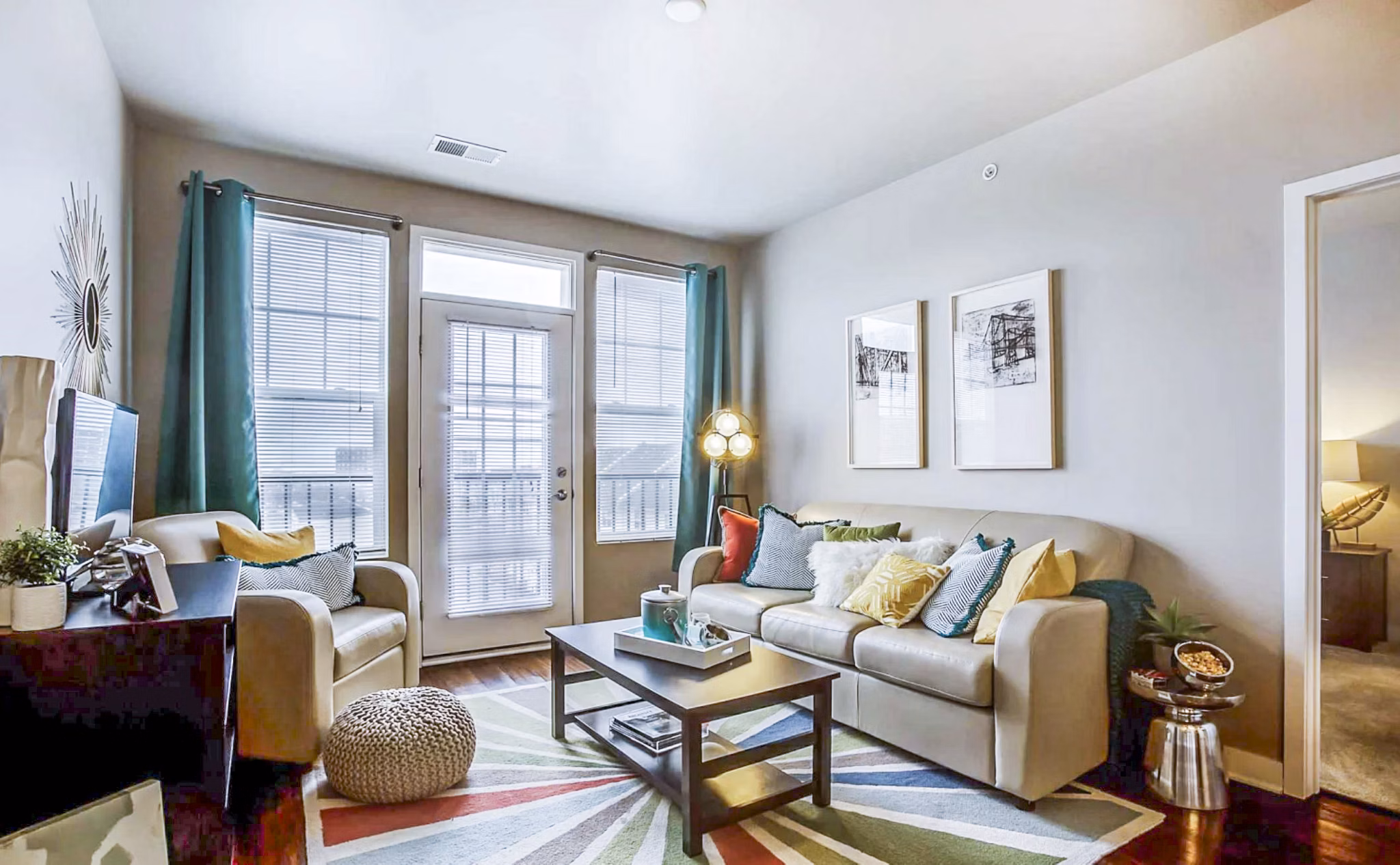 Spacious living room with contemporary decor at The Langston Apartments