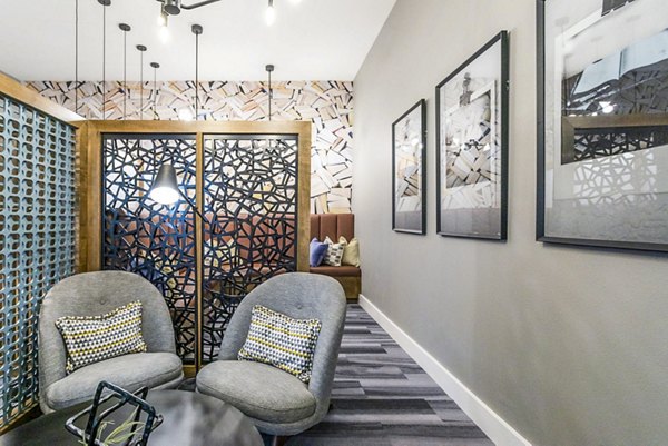 Clubhouse featuring cozy seating and billiards at Broadstone North Ridge Apartments
