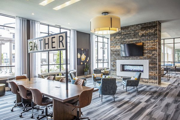 Modern clubhouse with lounge seating and pool tables at Broadstone North Ridge Apartments