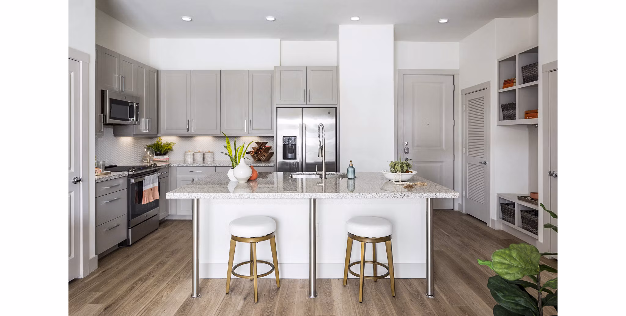 Kitchen with modern appliances and marble countertops in Broadstone North Ridge Apartments, luxury living option nearby major amenities