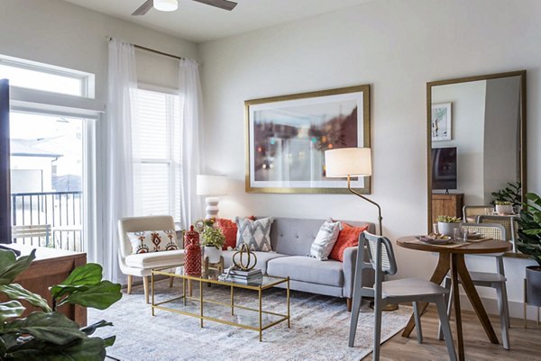Living room with modern decor and cozy seating at Broadstone North Ridge Apartments