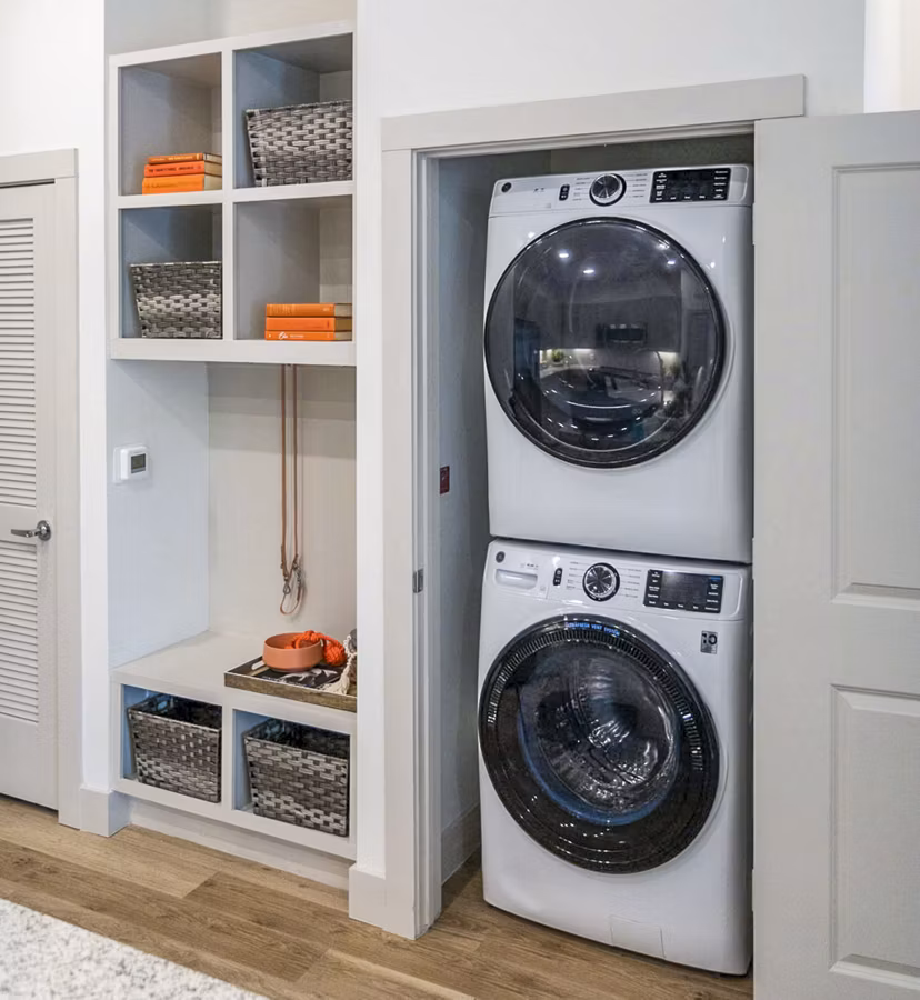 Laundry room with modern washers and dryers at Broadstone North Ridge Apartments