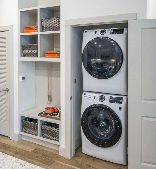 Laundry room with modern washers and dryers at Broadstone North Ridge Apartments