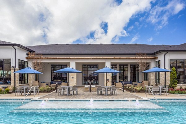 Expansive pool with lounge chairs at Broadstone North Ridge Apartments, a Greystar luxury community offering modern leisure amenities