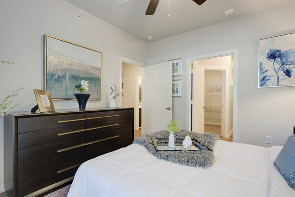 Cozy bedroom with modern decor at Roots at O'Connor Apartments