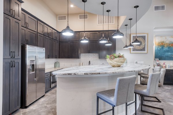 Clubhouse featuring modern decor and lounge areas at Roots at O'Connor Apartments luxury community