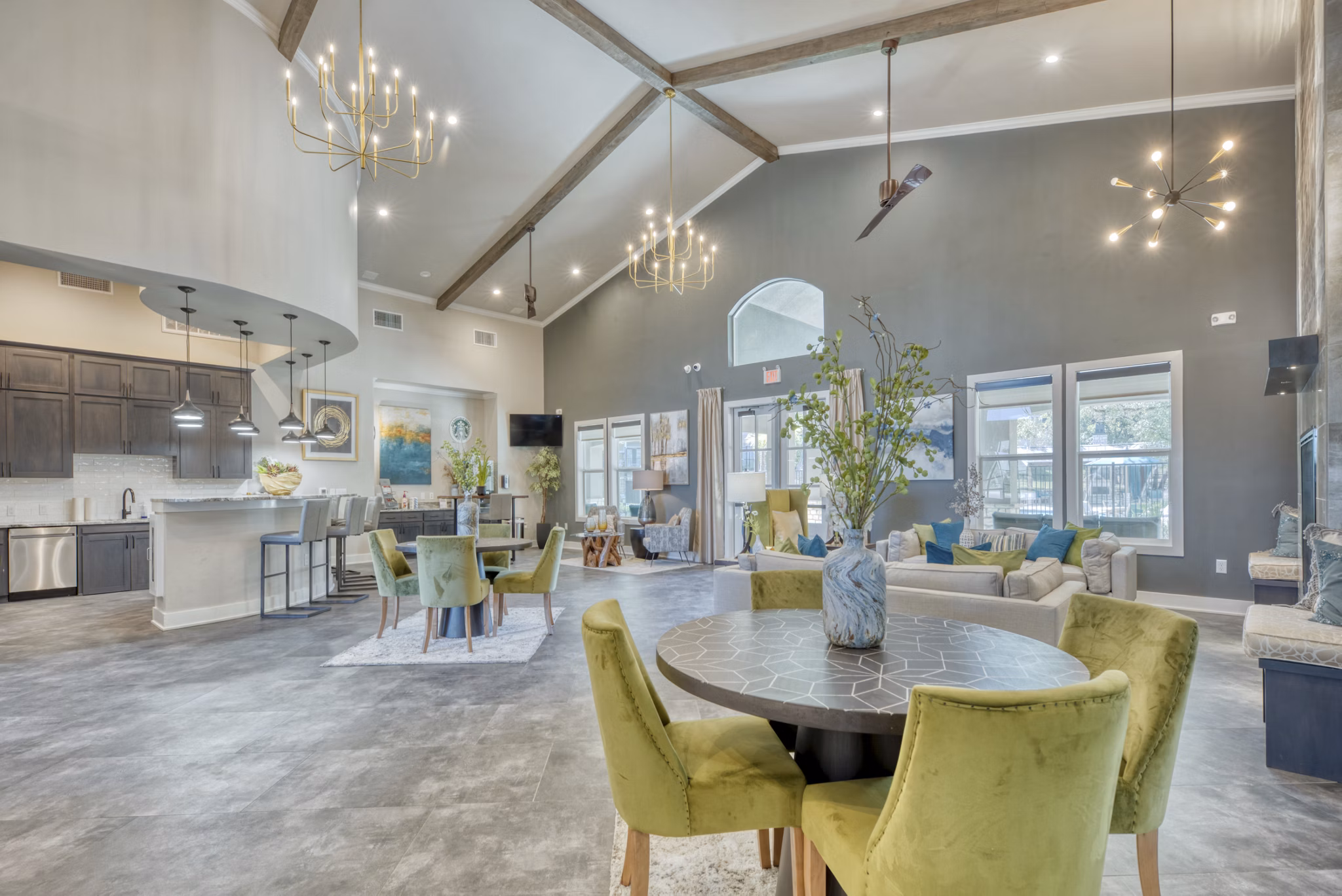 Modern clubhouse featuring cozy seating and entertainment options at Roots at O'Connor Apartments