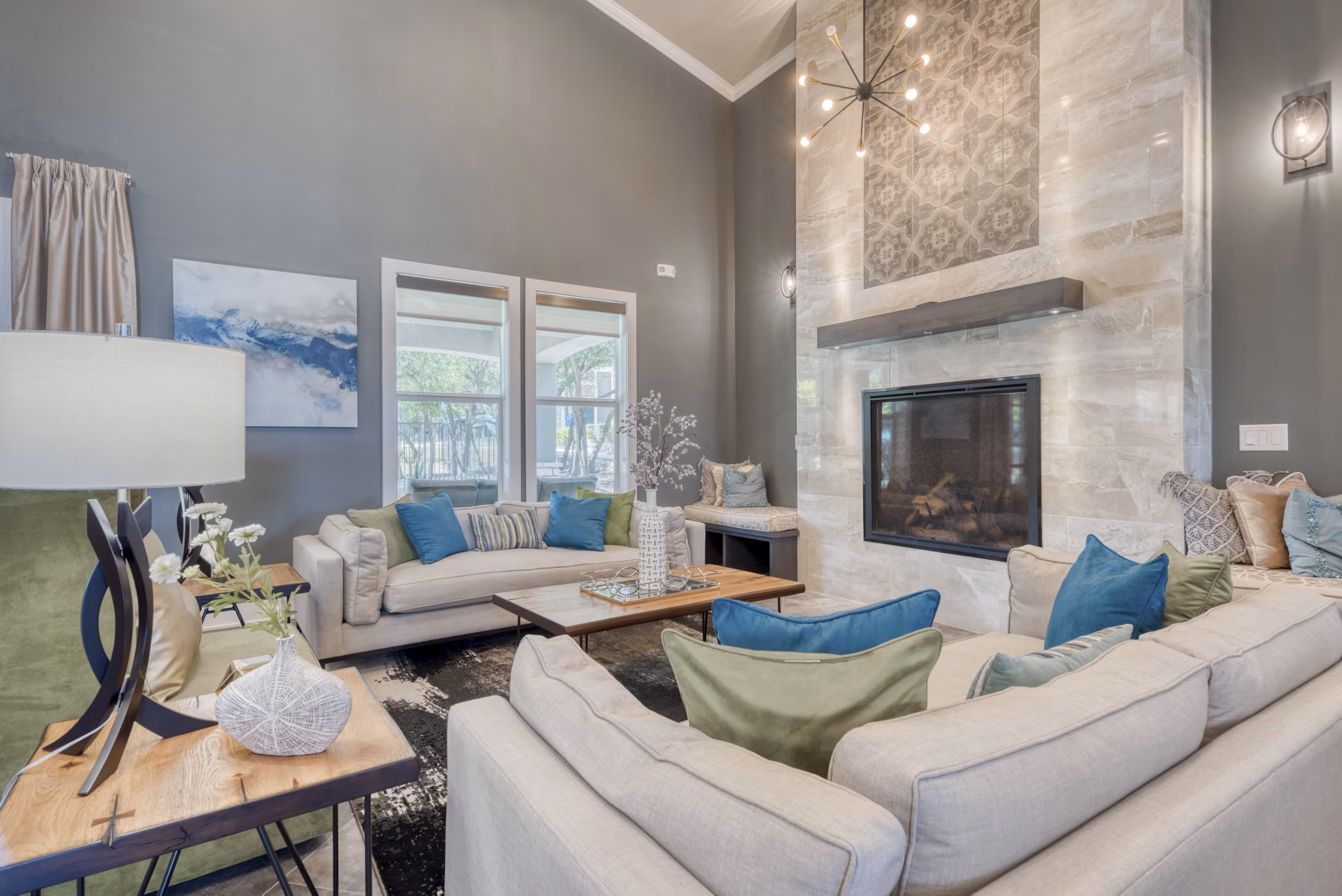 Modern clubhouse with lounge seating at Roots at O'Connor Apartments, offering residents luxurious amenities and social space