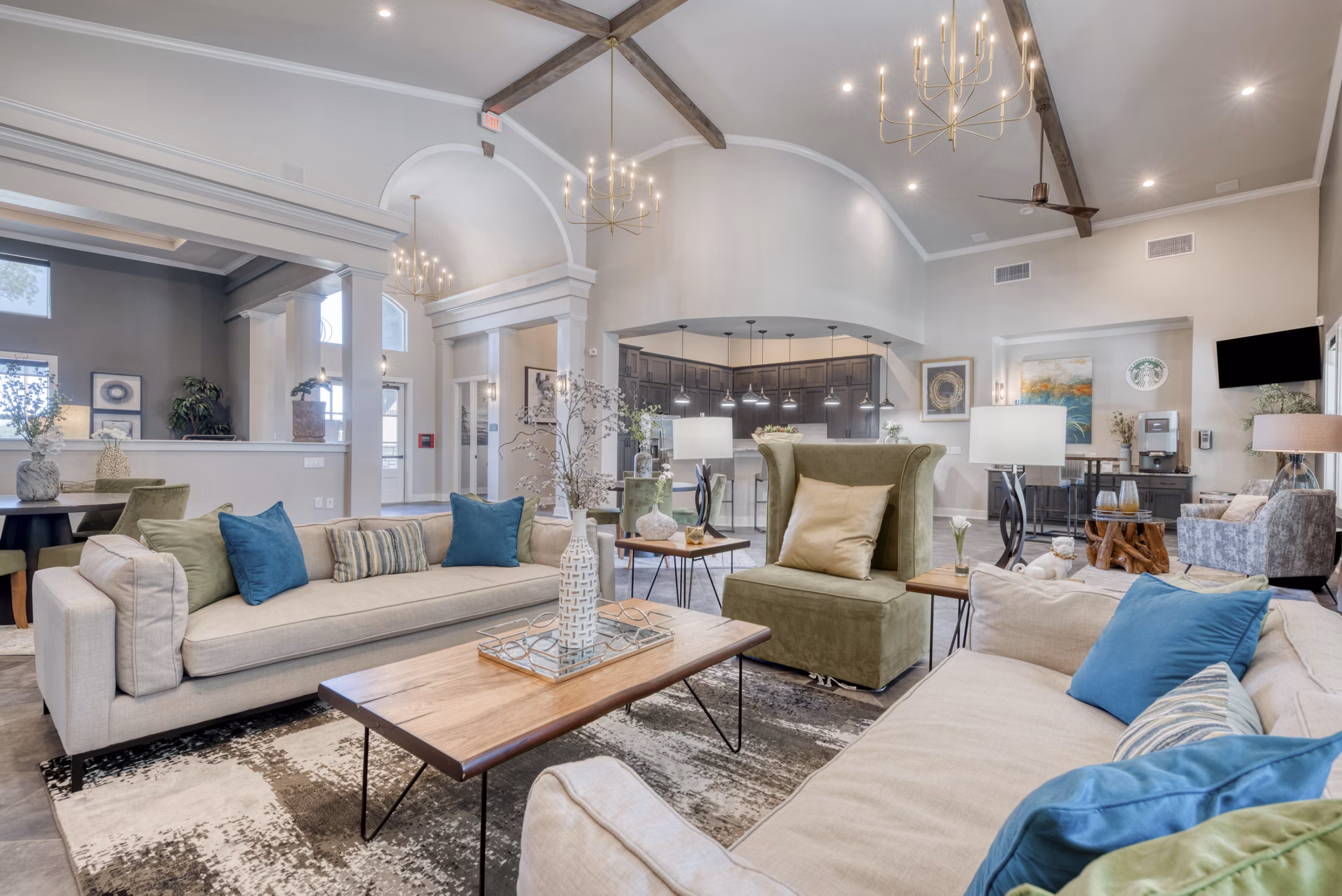 Clubhouse featuring modern design and cozy seating at Roots at O'Connor Apartments
