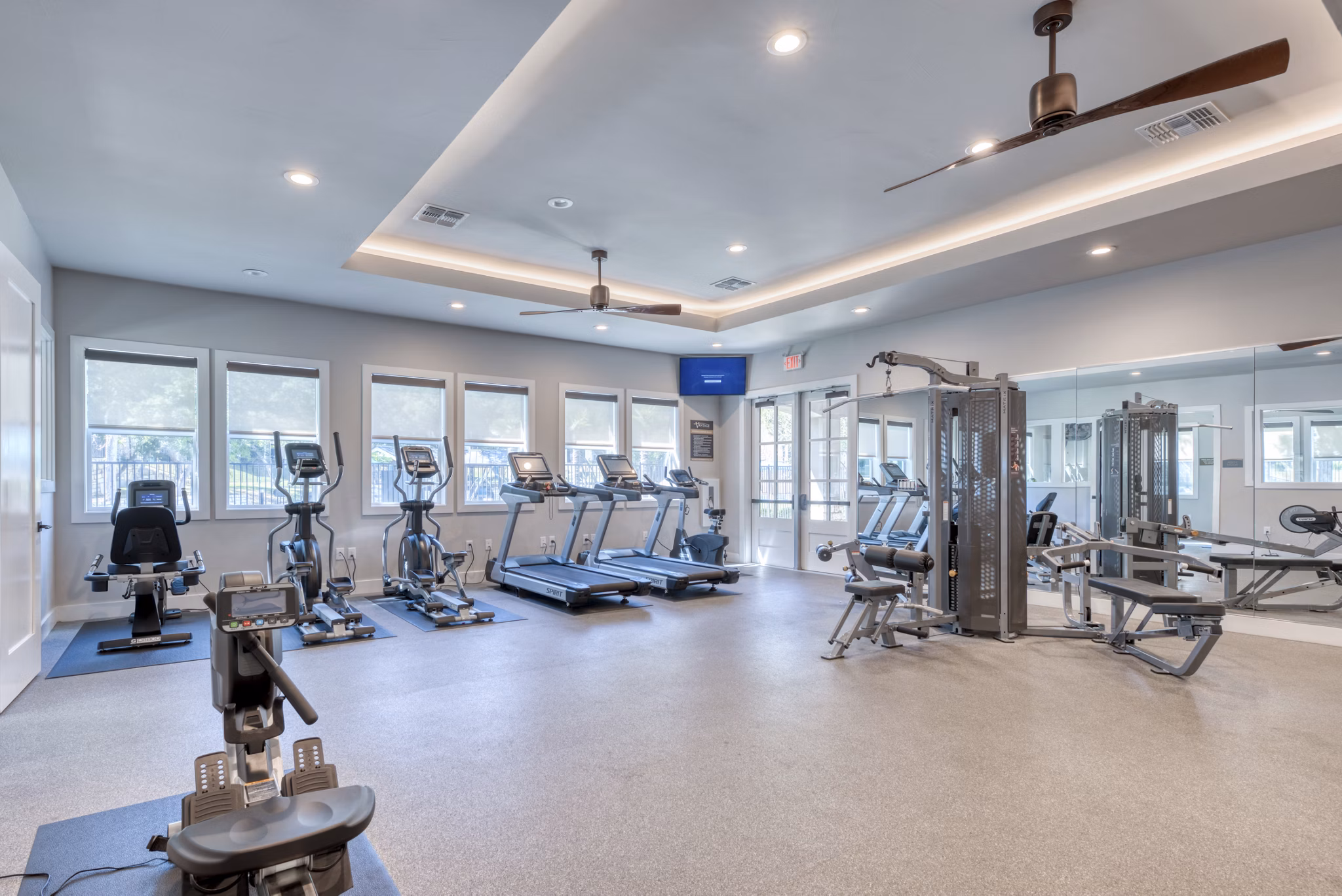 State-of-the-art fitness center with modern equipment at Roots at O'Connor Apartments
