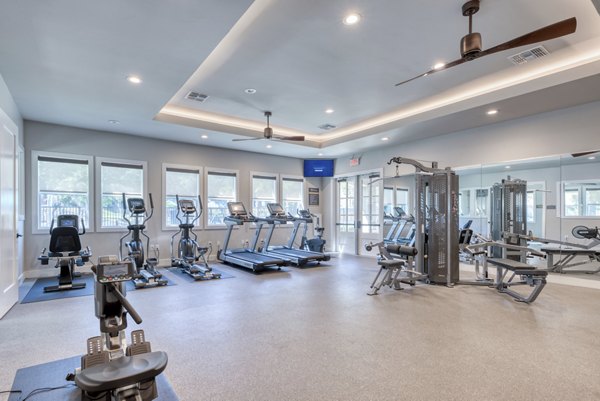 State-of-the-art fitness center with modern equipment at Roots at O'Connor Apartments