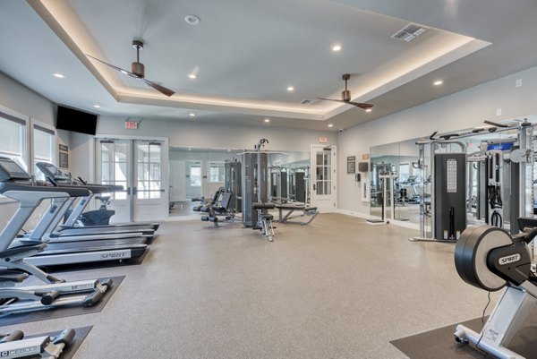 Fitness center with modern equipment at Roots at O'Connor Apartments