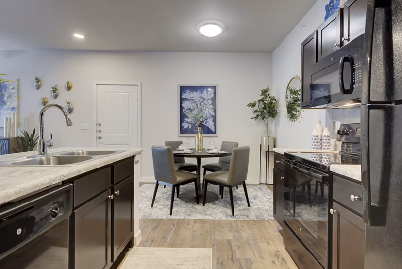 Bright kitchen with modern appliances at Roots at O'Connor Apartments, showcasing contemporary design Perfect for luxury living in a Greystar property