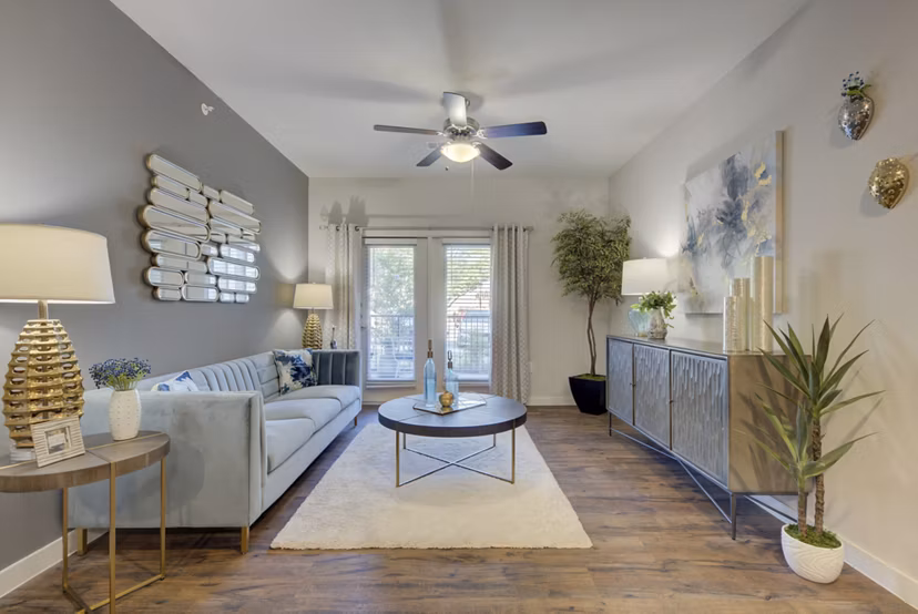 Spacious living room with modern furnishings in Roots at O'Connor Apartments, ideal luxury apartments for comfort and style