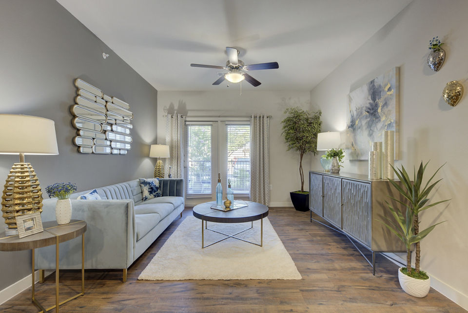 Spacious living room with modern furnishings in Roots at O'Connor Apartments, ideal luxury apartments for comfort and style
