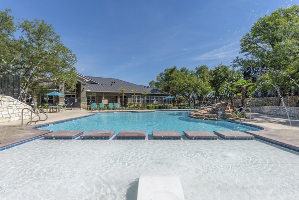 Pool at Roots at O'Connor Apartments offering luxury relaxation and stunning views Perfect for sunny days in a premium living environment