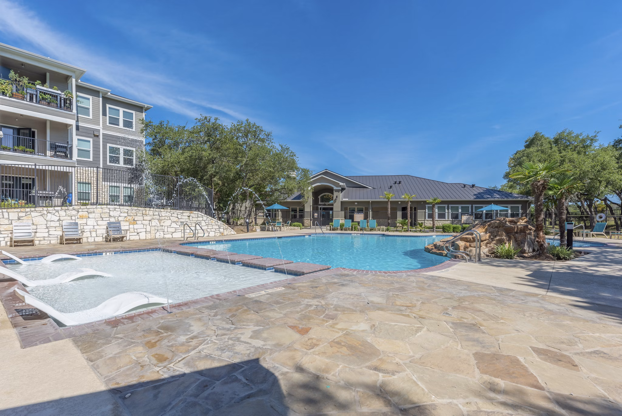 Resort-style pool with sun loungers at Roots at O'Connor Apartments