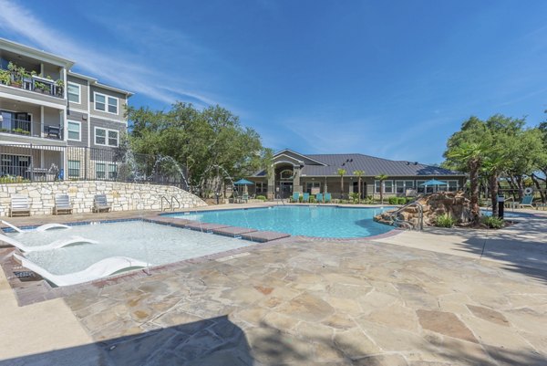 Resort-style pool with sun loungers at Roots at O'Connor Apartments
