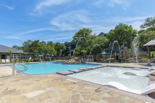 Resort-style pool area at Roots at O'Connor Apartments, perfect for relaxation and leisure