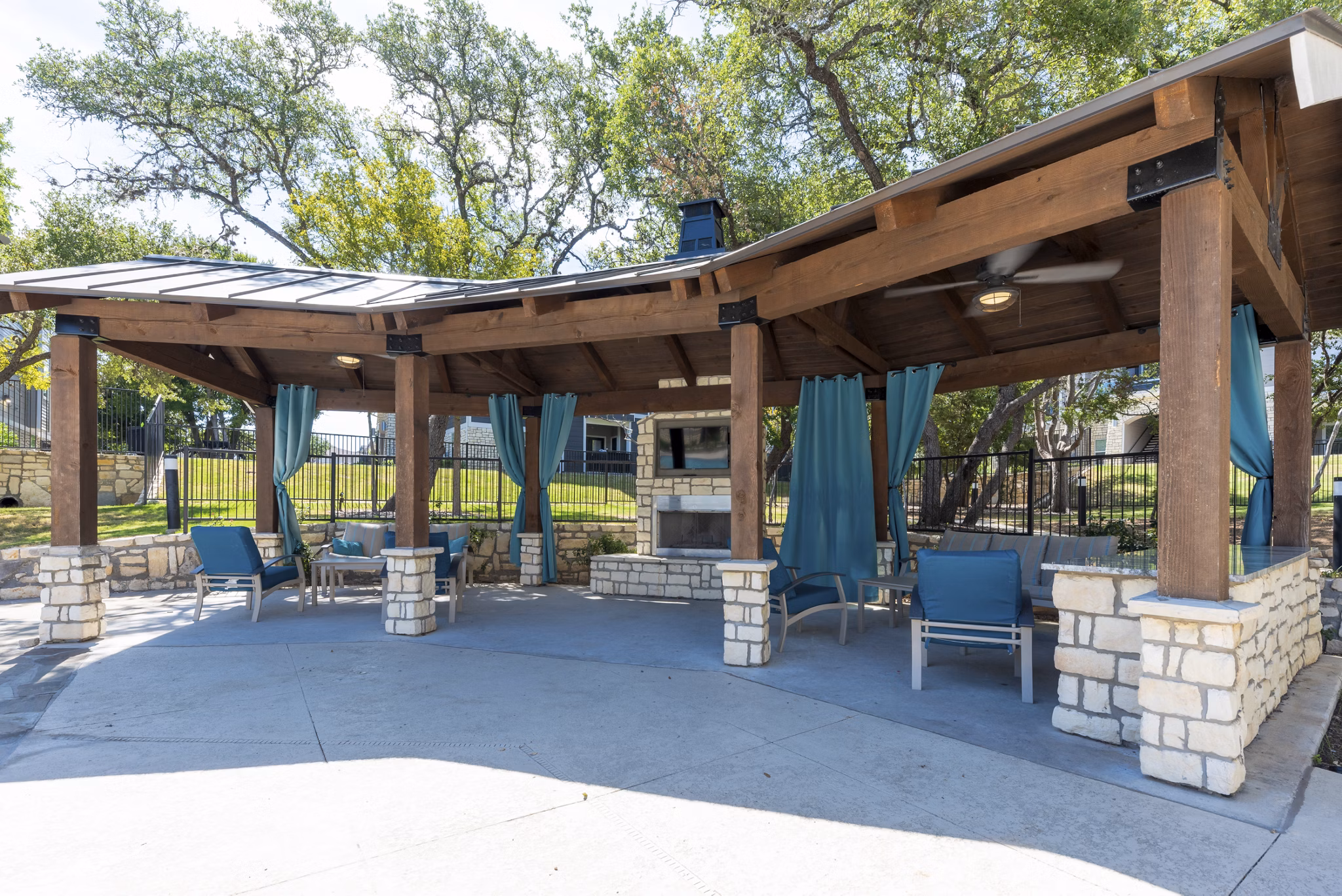 Cozy outdoor fire pit area at Roots at O'Connor Apartments, perfect for relaxation and social gatherings under starry skies