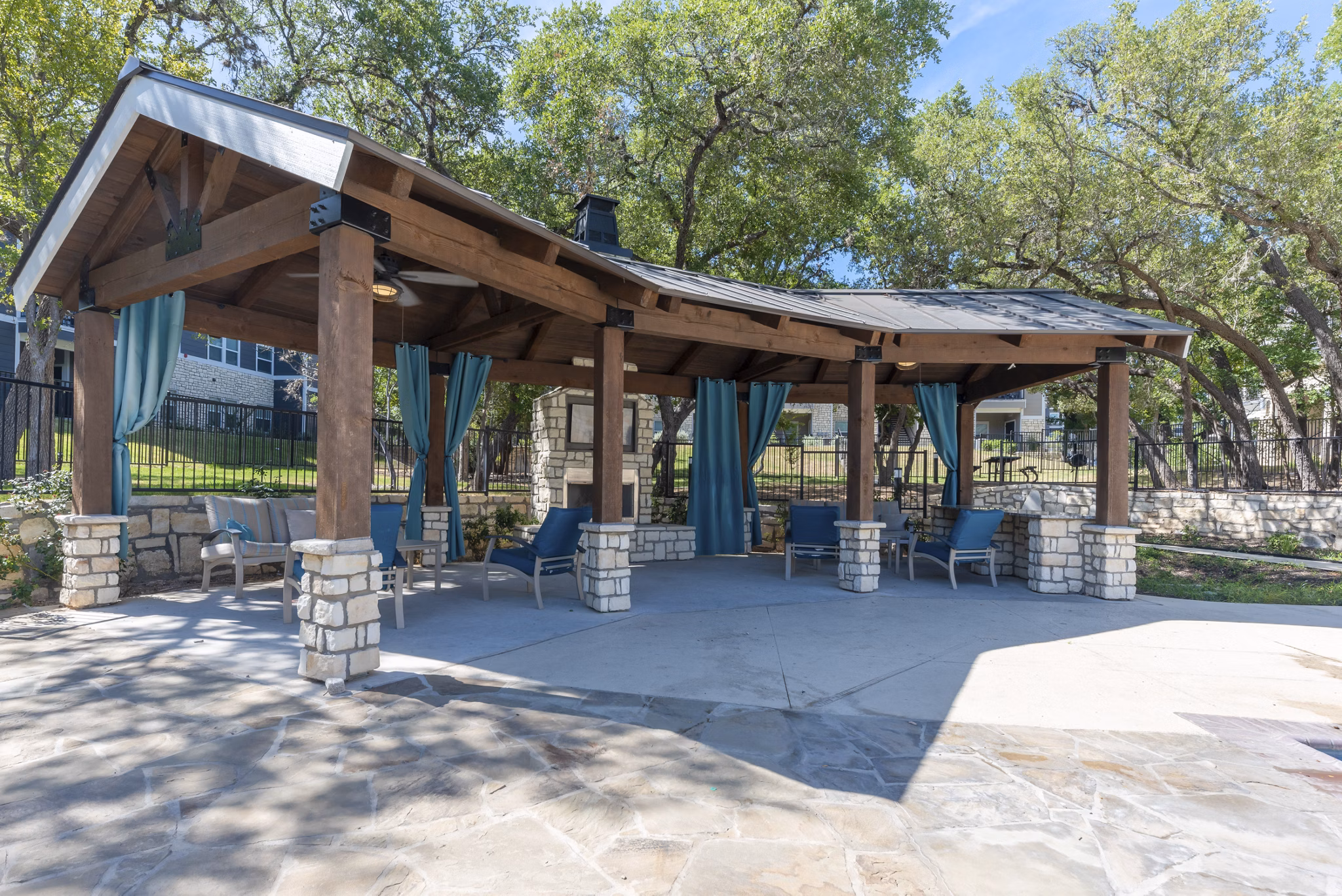 Cozy fire pit area at Roots at O'Connor Apartments, perfect for evening gatherings
