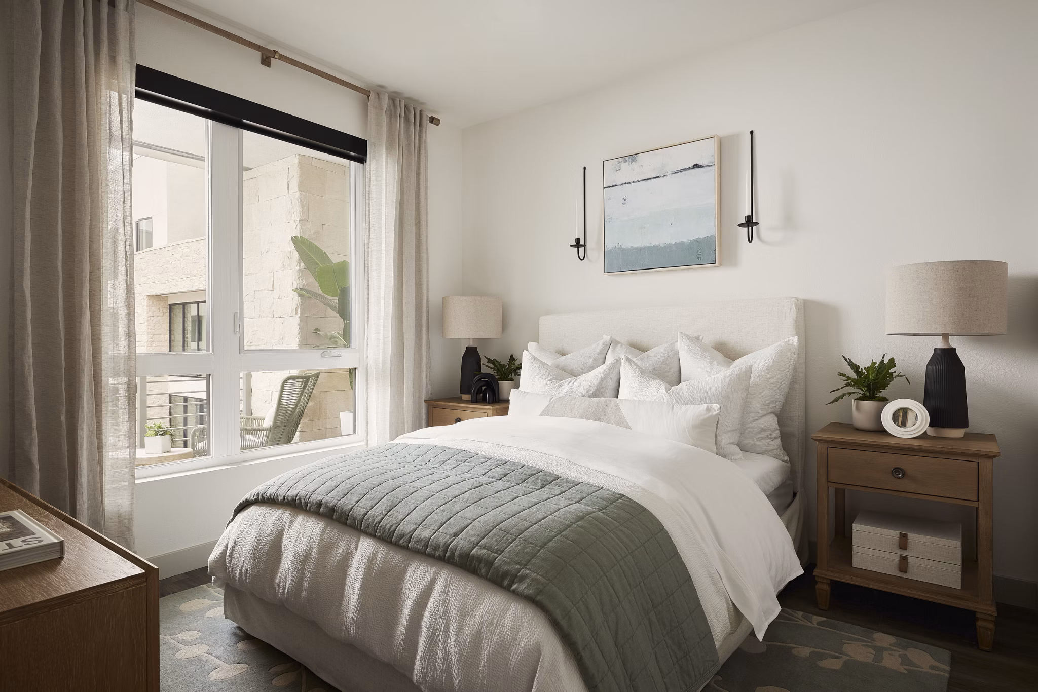 Elevate your living experience in the stylish bedroom at Santal Thousand Oaks Apartments, featuring elegant design and ample natural light