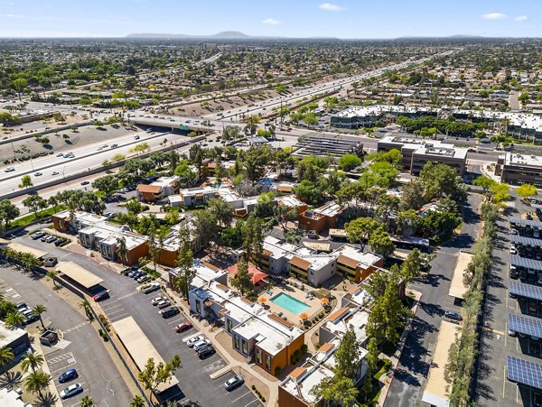 Villatree Apartments: Elegant building in a serene neighborhood, showcasing modern Greystar luxury apartments