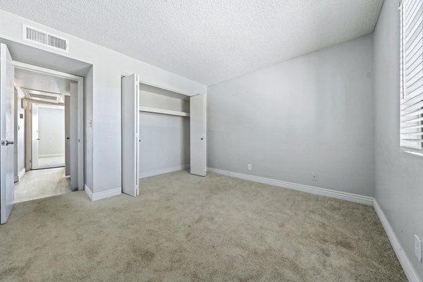 Cozy bedroom with modern decor at Villatree Apartments