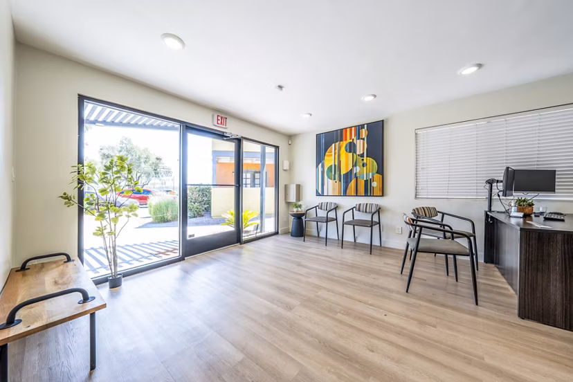 Modern clubhouse and leasing office with stylish furnishings at Villatree Apartments in Tempe, offering luxury living experiences