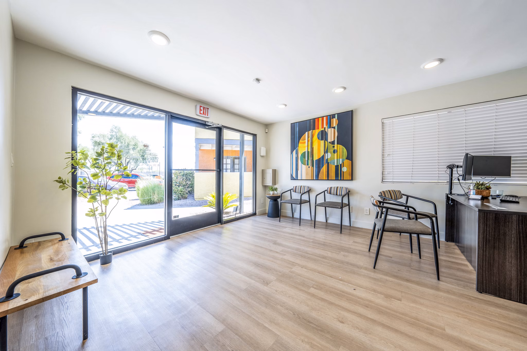Modern clubhouse and leasing office with stylish furnishings at Villatree Apartments in Tempe, offering luxury living experiences