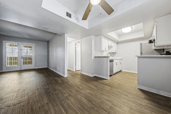 Spacious living room with modern furnishings at Villatree Apartments, offering luxury living by Greystar
