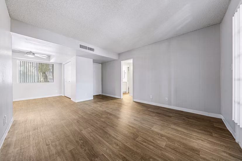 Spacious living room with modern decor in Villatree Apartments
