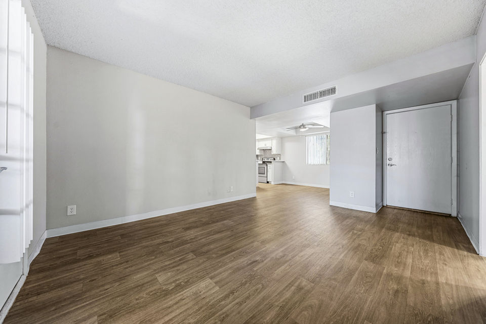 Modern living room with stylish decor and ample natural light at Villatree Apartments, a luxury community offering comfort and elegance