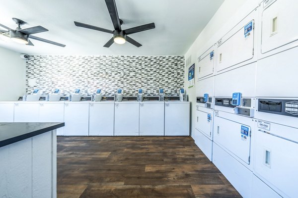 Modern laundry facility featuring high-efficiency machines at Villatree Apartments